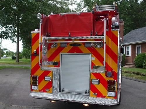 Rear view showing chevron striping and rear roll-up panel