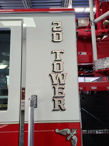 Door close-up showing vertical tower-unit numbering on white panel