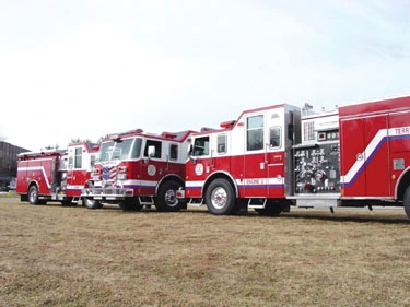 Lineup side view of multiple pumpers showing driver-side profiles and pump panel areas