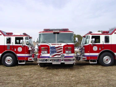 Close lineup view showing front ends, side mirrors, and cab doors