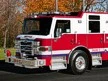 Terryville fire engine driver-side profile showing pump panel and body compartments