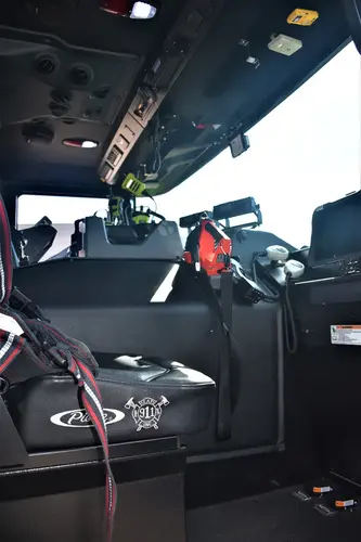 Driver cockpit view showing steering wheel, dashboard, and center console