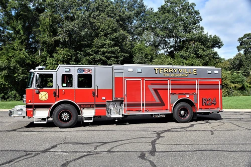 Driver-side profile showing pumper body and rear wheel area