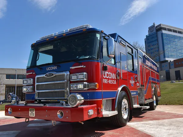 Pumper front-left exterior view showing grille, bumper, and enclosed cab