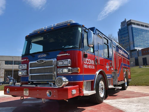 Pumper front-left exterior view showing grille, bumper, and enclosed cab