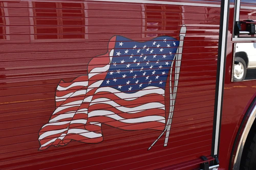 Body panel close-up showing painted American flag graphic on red door