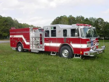 Pumper front-left exterior view showing enclosed cab and side compartments