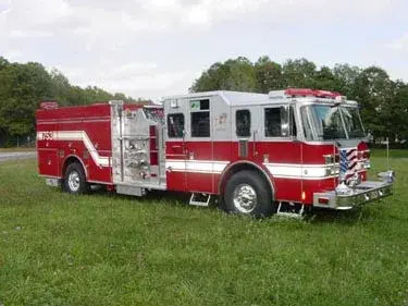 Pumper front-left exterior view showing enclosed cab and side compartments