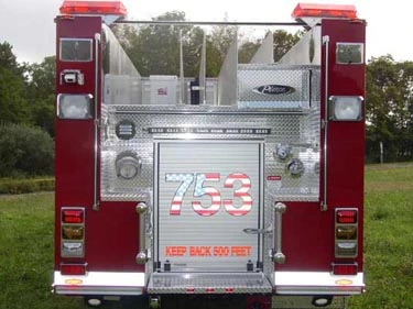 Rear view showing rear panel, warning lights, and lower step