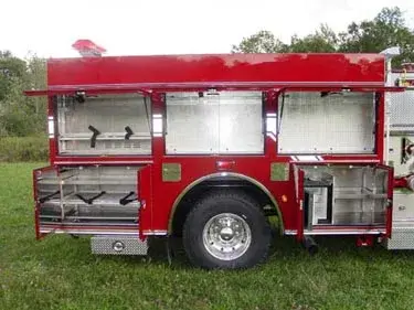 Open passenger-side compartments showing shelves and storage bays