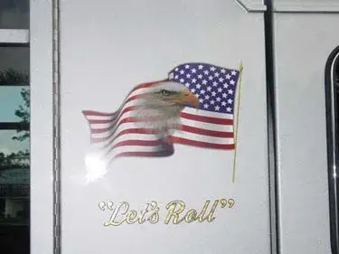 Side panel decal close-up showing flag graphic and script text