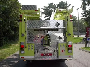 Rear view showing rear panel, hose connections, and warning lights