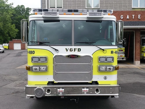 Head-on front view showing grille, windshield, warning lights, and front bumper intake ports.