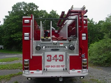 Rear view showing rear panel, warning lights, and hosebed divider fins