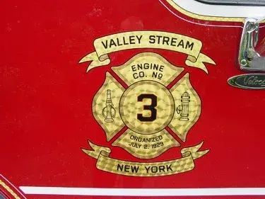 Shield logo close-up on red side panel