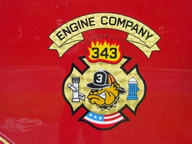 Company crest logo close-up on red side panel