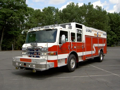 Front-left exterior view showing pumper grille and cab profile