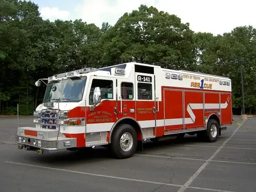 Driver-side profile view showing pumper body and compartment line