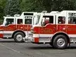Side lineup view showing multiple apparatus parked nose-to-tail