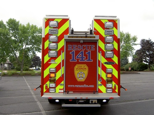 Rear view showing chevrons, rear lights, and center rear panel