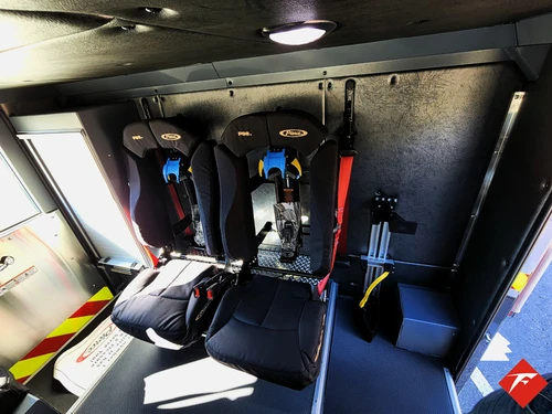 Cab interior side view showing rear seat area and side window