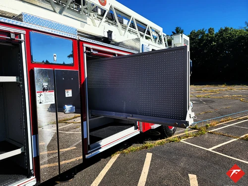 Open side compartment with large slide-out tray extended from body