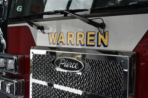 Front grille close-up showing Pierce badge and raised lettering