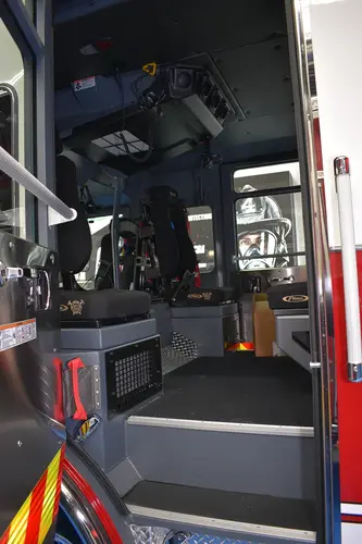 Cab interior rear view showing center aisle and seat area