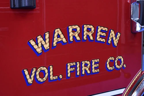 Cab-side lettering close-up on red door panel