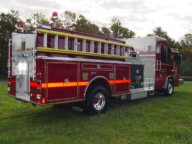 Rear-right exterior view showing side compartments and hosebed ladder rack