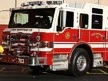 Front-left exterior profile showing pumper cab and side body