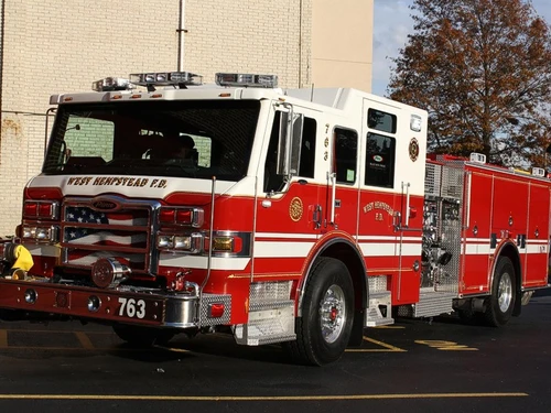 Front-left exterior close view showing grille, bumper, and cab