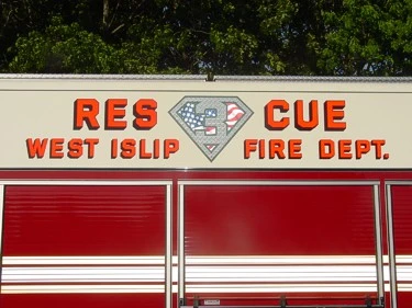 Side body logo close-up showing RESCUE lettering and the diamond emblem graphic.