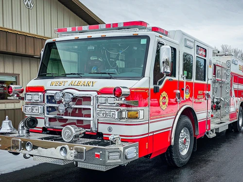 Pumper front-left exterior view showing grille, bumper, and side body