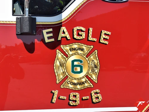 Door emblem close-up showing gold badge and number panel