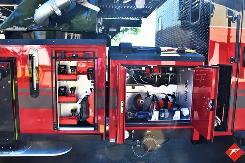 Open side compartment showing generator, tools, and equipment storage
