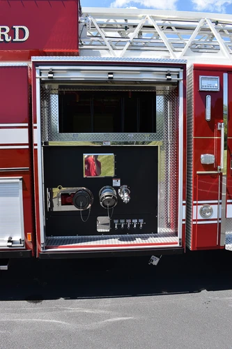 Open side compartment showing slide-out tray and interior storage bay