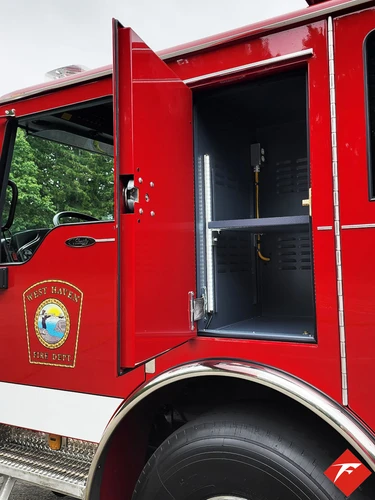 Rear cab door open view showing dark interior and entry step