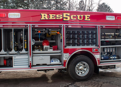 Weston Pierce heavy rescue full driver-side exterior view parked in front of the firehouse