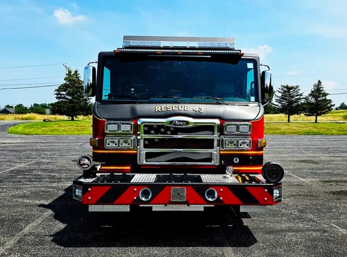 Rescue truck front view showing grille, bumper, and warning lights