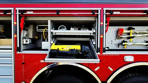 Open side compartment showing generator unit and tool storage
