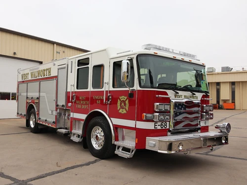 Pumper front-left exterior view showing grille, bumper, and crew cab