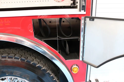 Rear wheel close-up showing fender arch, tire, and lower body panel