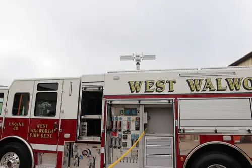 Upper body side close-up showing raised lettering panel above compartments