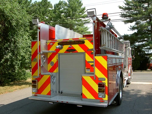 Rear view showing chevrons, rear panel, and warning lights