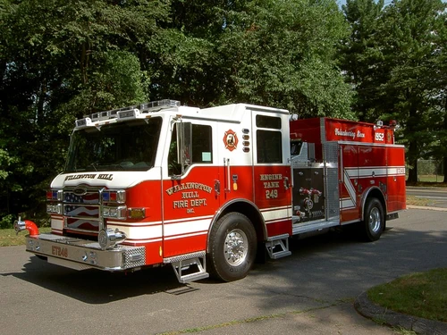 Front-left exterior view showing bumper, cab, and side body