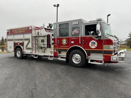 Officer-side profile view showing side pump panel and compartment doors