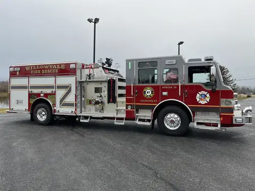Officer-side profile view showing side pump panel and open rear compartment