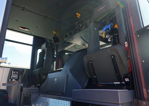 Cab interior side view showing rear seats and center aisle