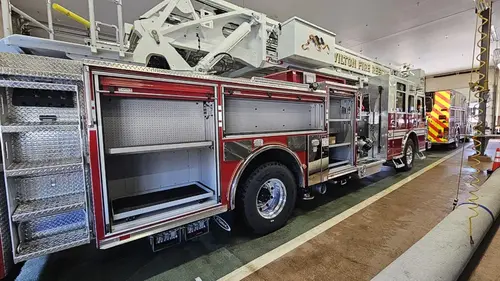 Open side compartment showing long storage bay and shelf space
